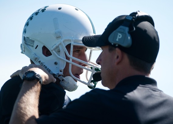 Father Gabriel Richard senior quarterback Mason Sarosi talks with Head Coach Brian Lemons in the first half of the game against Macomb Lutheran North on Saturday. FGR won 24-10. Daniel Brenner I AnnArbor.com